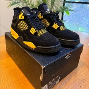 Air Jordan 4 Retro - Black/Tour Yellow/White
Size M 9 / W 10.5